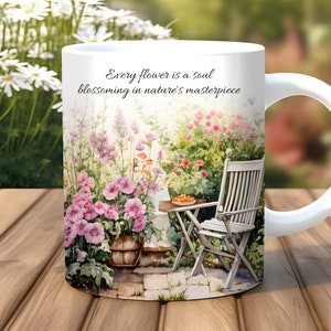 May include: White ceramic mug with a watercolor illustration of a garden scene. The mug features a quote: "Every flower is a soul blossoming in nature's masterpiece."