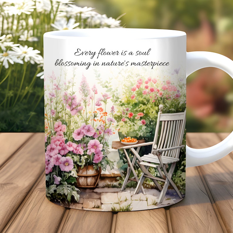 May include: White ceramic mug with a watercolor illustration of a garden scene. The mug features a quote: "Every flower is a soul blossoming in nature's masterpiece."