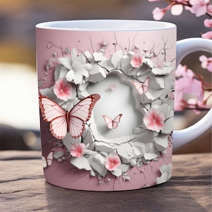 Könnte beinhalten: Eine rosa Keramiktasse mit einem weißen und rosa Blumendesign. Das Design zeigt Schmetterlinge und Blumen, die aus einer rissigen, weißen Oberfläche herauswachsen.