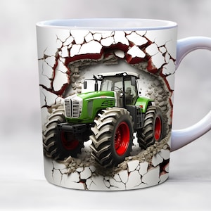 May include: A white ceramic mug with a green and black tractor breaking through a cracked white wall. The tractor has large tires and a red rim.