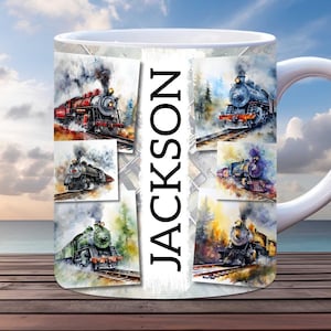 May include: White ceramic mug featuring a watercolour design of six vintage steam locomotives. The mug has the name "JACKSON" printed vertically on the side.