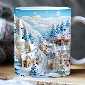 May include: A white ceramic mug featuring a winter village scene printed on it. The scene depicts paper-like houses, trees, and a winding path. The background is a light blue sky with snowflakes.