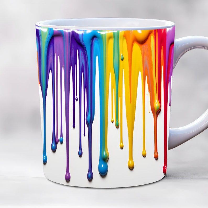 May include: White ceramic coffee mug with rainbow colored paint dripping down the side.