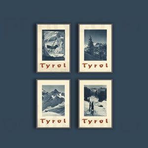 May include: A set of four rectangular posters featuring monochromatic winter mountain scenes in Tyrol. Each print displays a unique snowy landscape with the word Tyrol printed in a bold, dark red font at the bottom of the cream-colored border.