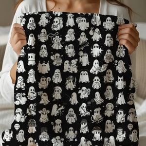 May include: A black and white throw blanket with a repeating pattern of ghosts. Each ghost has a different expression and is holding a different object, such as a book, a cup of coffee, a telescope, a skateboard, a boombox, a camera, a paintbrush, a flower, a balloon, a peace sign, a mushroom, and a music note. The ghosts are all outlined in black and have a white fill. The background is black.