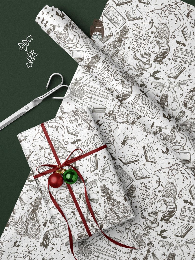 May include: White wrapping paper with a fantasy book theme, featuring illustrations of dragons, wolves, and books. A wrapped gift is adorned with a red ribbon and ornaments. The text reads "Once upon a time there was a girl who loved to read."