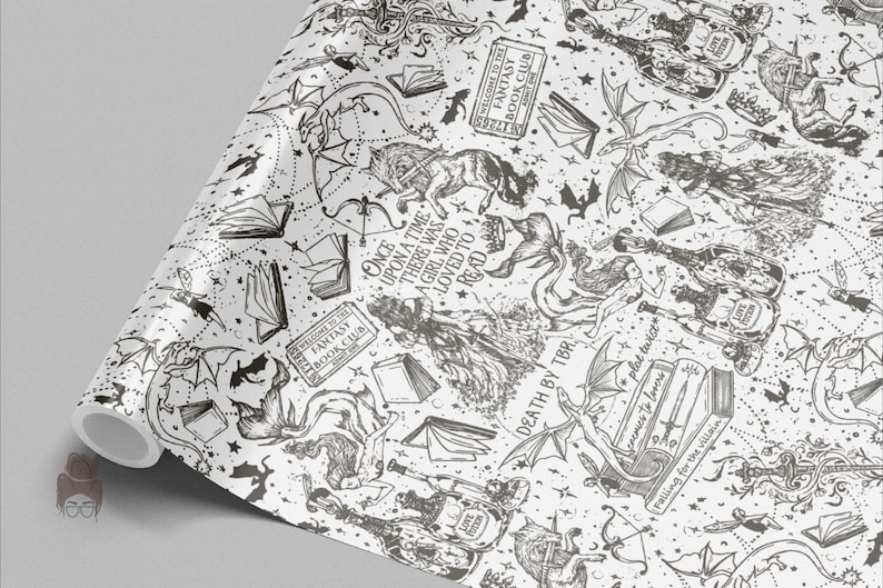 May include: A roll of white wrapping paper with a black fantasy-themed design. The pattern includes dragons, books, stars, and text that reads "Once upon a time there was a girl who loved to read" and "Welcome to the Fantasy Book Club."