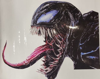 May include: A black and red Venom character with a large mouth and sharp teeth. The character has a long, red tongue and a blue eye.
