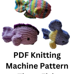 May include: PDF knitting machine pattern for three fish. The fish are knitted in different colors, including pink, blue, yellow, and purple.