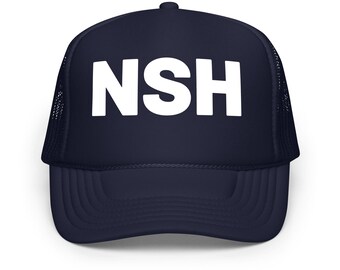 May include: Navy blue trucker hat with the white letters "NSH" across the front. The hat has a mesh back and a curved brim. A casual accessory for everyday wear.