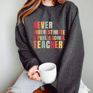 Never Underestimate A Public School Teacher Sweatshirt, Kamala Harris 2024 Madam President, Democrat Sweatshirt, Educator Sweatshirt