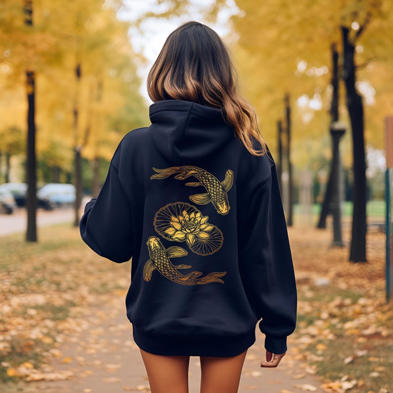 May include: Black hoodie with a gold graphic of two koi fish swimming around a lotus flower.