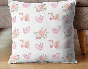 May include: White pillowcase featuring a repeating pattern of pink hearts, butterflies, and floral bouquets. The design is in a watercolour style with soft pink and green shades.