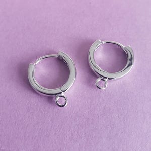 May include: A set of three ceramic mugs with a speckled, matte finish. The mugs are in shades of cream, light brown, and dark brown. Each mug has a simple, minimalist design, perfect for coffee or tea.