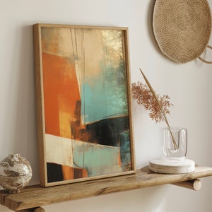 May include: A rectangular framed wall art piece featuring an abstract composition of bold orange, teal, and black geometric shapes with cream-colored accents. The artwork is enclosed in a light-toned wooden frame with a clean, simple profile.