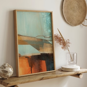 May include: Abstract landscape painting in a wooden frame with muted blue, brown, and orange tones. The painting is hanging on a wooden shelf with a vase and a woven basket on the wall behind it.