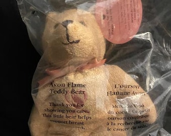 2001  Avon Canadian Breast Cancer Flame Teddy Bear.  Beige bear, Pink flame heart embroidery, Pink bow, Pink tag.  7&quot; tall  In polybag   New