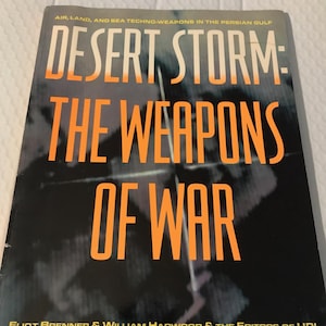 May include: A book titled "Desert Storm: The Weapons of War" with orange text on a dark background. The cover includes the text "Air, Land, and Sea Techno-Weapons in the Persian Gulf" and author information.