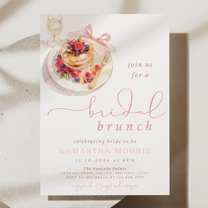 Peut inclure: Une invitation &agrave; un brunch de mariage rose et blanche avec une illustration aquarelle d'une assiette de cr&ecirc;pes, de baies et d'un verre de champagne. Le texte indique "rejoignez-nous pour un brunch de mariage c&eacute;l&eacute;brant la future mari&eacute;e SAMANTHA MORRIS 12.10.2024 &agrave; 16h00 The Passke Palace RSVP &agrave; MICHELLE au 123-436-7891"