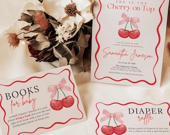 May include: Three printable cards for a baby shower. The first card is red and white with the text "BOOKS for baby" and a cherry illustration. The second card is red and white with the text "SHE IS THE Cherry on Top" and a cherry illustration. The third card is red and white with the text "DIAPER raffle" and a cherry illustration.