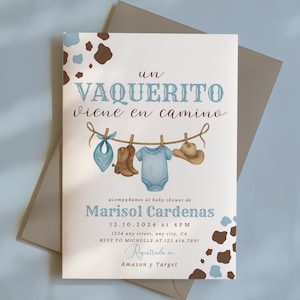 May include: Baby shower invitation with the text "un VAQUERITO viene en camino" in blue script. The invitation features watercolor illustrations of cowboy boots, a onesie, a hat, and a bandana hanging on a clothesline. The invitation is for Marisol Cardenas.