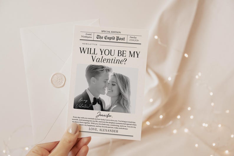 May include: A Valentine's Day card with the headline "Will You Be My Valentine?" in a newspaper-style design. The card includes a black and white photo of a couple. An envelope with a wax seal is also visible. The text "The Cupid Post" is at the top.