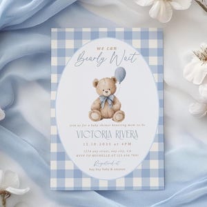 May include: Baby shower invitation with a blue gingham background. The invitation features a teddy bear holding a balloon, with the text "Bearly Wait." Details include the name Victoria Rivera, date, time, and RSVP information.