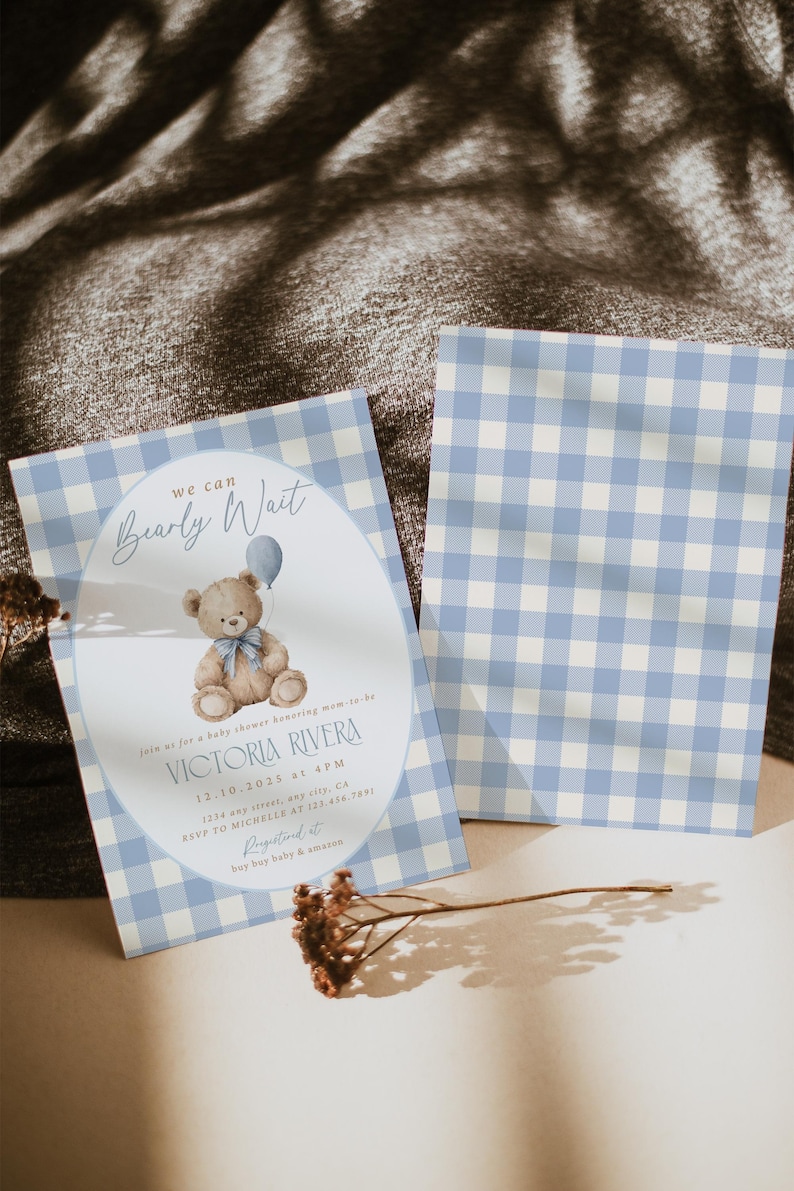 May include: Baby shower invitation featuring a teddy bear holding a blue balloon. The invitation has a light blue and white gingham pattern. Text includes "Bearly Wait" and details for Victoria Rivera's baby shower.