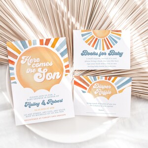 May include: A set of three baby shower cards with a sunburst design in shades of blue, orange, and yellow. The cards feature the text "Here comes the Son", "Books for Baby", and "Diaper Raffle".