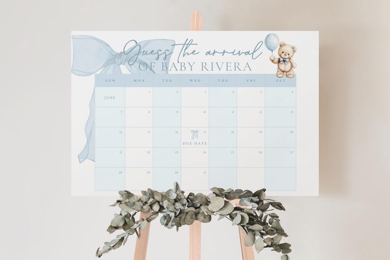 May include: A blue and white calendar with a blue bow and a teddy bear holding a balloon. The calendar is for guessing the arrival of baby Rivera. The calendar has the months of June and July.