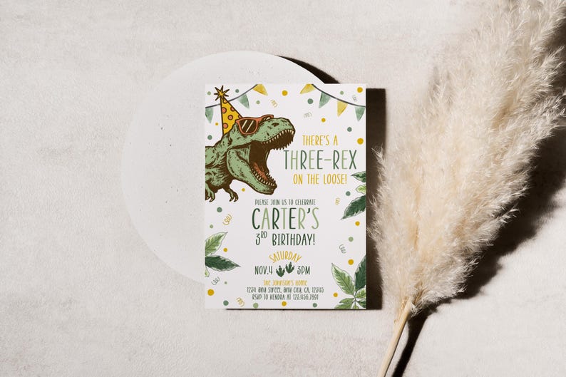 May include: A birthday invitation with a green dinosaur wearing sunglasses and a party hat. The text reads "There's a Three-Rex on the Loose!" and "Carter's 3rd Birthday!" with the date and time.