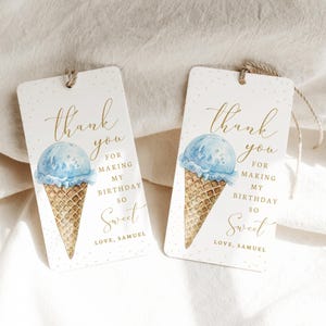 May include: Two thank you tags featuring a watercolour illustration of a blue ice cream cone in a waffle cone. The text on the tags reads "thank you for making my birthday so sweet, love, Samuel".