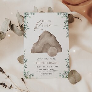 May include: A white card with green foliage border and a watercolor illustration of a stone tomb with a rolling stone. The text on the card reads "He is Risen" and includes an invitation to an Easter brunch hosted by The Petersons on December 10, 2025 at 4 PM at The Johnson's Home.