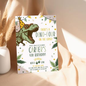 May include: A dinosaur-themed birthday invitation. The design features a green dinosaur wearing sunglasses and a party hat. The text reads "There's a Dino-Four on the Loose!" and includes details for Carter's 4th birthday.