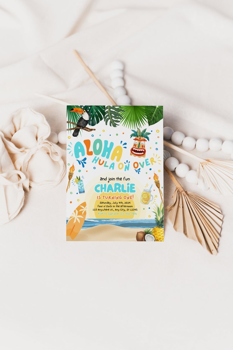 May include: A colorful invitation for a luau-themed birthday party. The invitation features a toucan, a tiki mask, and a surfboard. The text on the invitation reads "Aloha Hula On Over and join the fun Charlie is turning one! Saturday, July 4th, 2024 four o'clock in the afternoon 123 Anywhere st., Any City, St 12345 RSVP to Sophal at 123-456-789L"