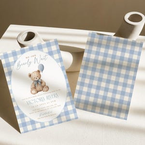 May include: Baby shower invitation with a blue and white gingham pattern. The invitation features the text "We can Bearly Wait" and includes a teddy bear holding a balloon. The invitation also includes the name "Victoria Rivera" and event details.
