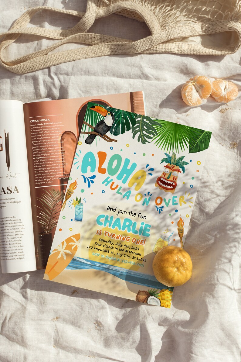May include: A colorful invitation for a luau themed first birthday party. The invitation features a toucan, a tiki mask, and the text "Aloha Hula On Over and join the fun Charlie is turning one!"  The invitation also includes the date, time, and location of the party.