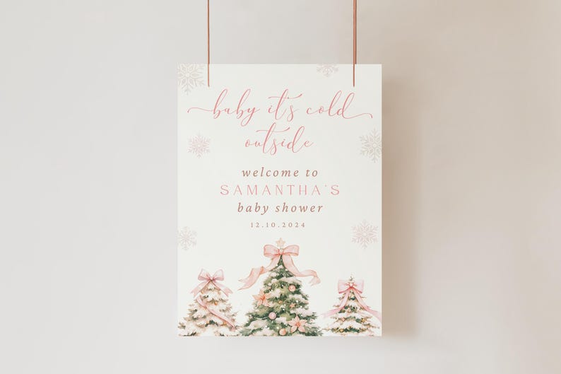 May include: A pink and white baby shower sign with the text "baby it's cold outside" and "welcome to Samantha's baby shower 12.10.2024". The sign features three watercolor illustrations of Christmas trees with pink bows.