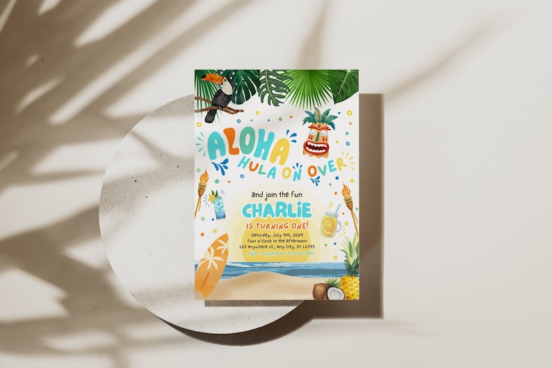May include: A colorful invitation for a luau themed birthday party. The invitation features a toucan, a tiki mask, and the text "Aloha Hula On Over" and "Charlie is turning one!"