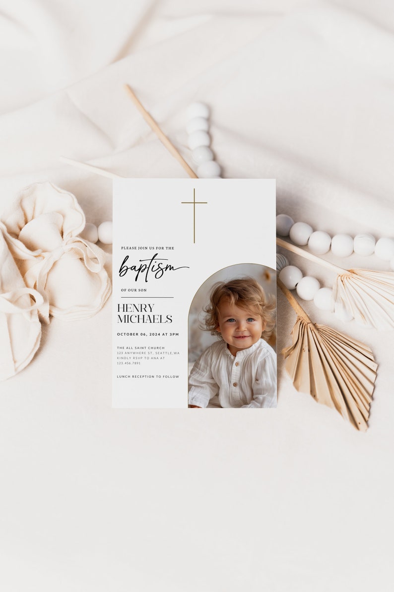 May include: A white card with a gold cross at the top. The text reads "Please join us for the baptism of our son Henry Michaels October 06, 2024 at 3pm The All Saint Church 123 Anywhere St. Seattle, WA Kindly RSVP to Ana at 123 456 7892 Lunch reception to follow". A photo of a baby boy is in the bottom right corner.