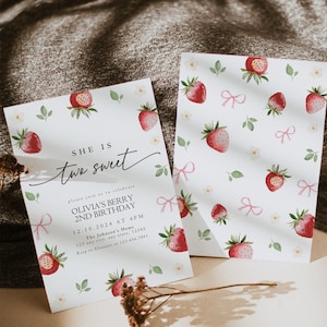 May include: A pink and white invitation card with a watercolor strawberry pattern. The text on the card reads "She is two sweet" and includes details for Olivia's Berry 2nd Birthday party.