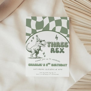 May include: A white invitation card with a green and white checkered pattern at the top. The card features a cartoon dinosaur wearing sunglasses and a party hat, with the text "THREE REX". The invitation is for Charlie's 3rd birthday.