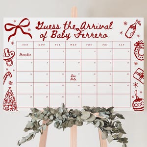 May include: A white calendar with red text and illustrations, designed for a baby shower. The text reads "Guess the Arrival of Baby Ferrero" with a calendar grid and "Due Date" marked. Festive holiday-themed drawings surround the calendar.