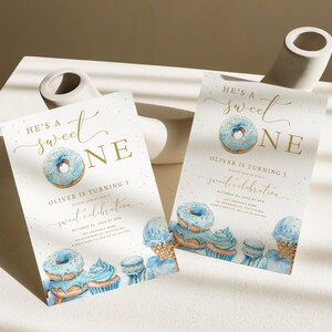 May include: Blue and gold donut-themed first birthday party invitation with the text "He's a Sweet One" and the name "Oliver".