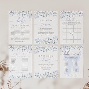 May include: Set of six baby shower game cards with a blue floral design. The games include: Baby Word Scramble, Late Night Diapers, Baby Bingo, The Price is Right, Baby Sock Hunt, and Baby Animals.