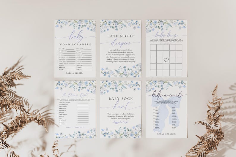 May include: Set of six baby shower game cards with a blue floral design. The games include: Baby Word Scramble, Late Night Diapers, Baby Bingo, The Price is Right, Baby Sock Hunt, and Baby Animals.