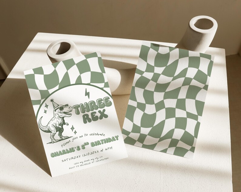 May include: Two party invitations with a green and white checkered pattern. One invitation features a dinosaur wearing sunglasses and a party hat, with the text "THREE REX" and "CHARLIE'S 3rd BIRTHDAY". The other invitation has the same checkered pattern.