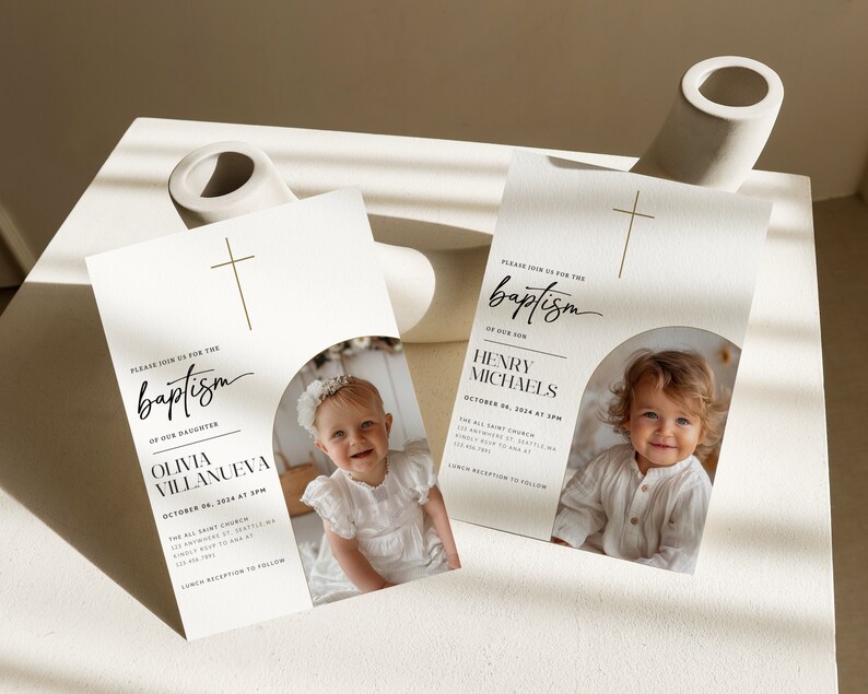 May include: Two baptism invitations with a gold cross and a photo of a baby in a white dress and a baby in a white shirt. The text on the invitations reads "Please join us for the baptism of our daughter Olivia Villanueva" and "Please join us for the baptism of our son Henry Michaels".