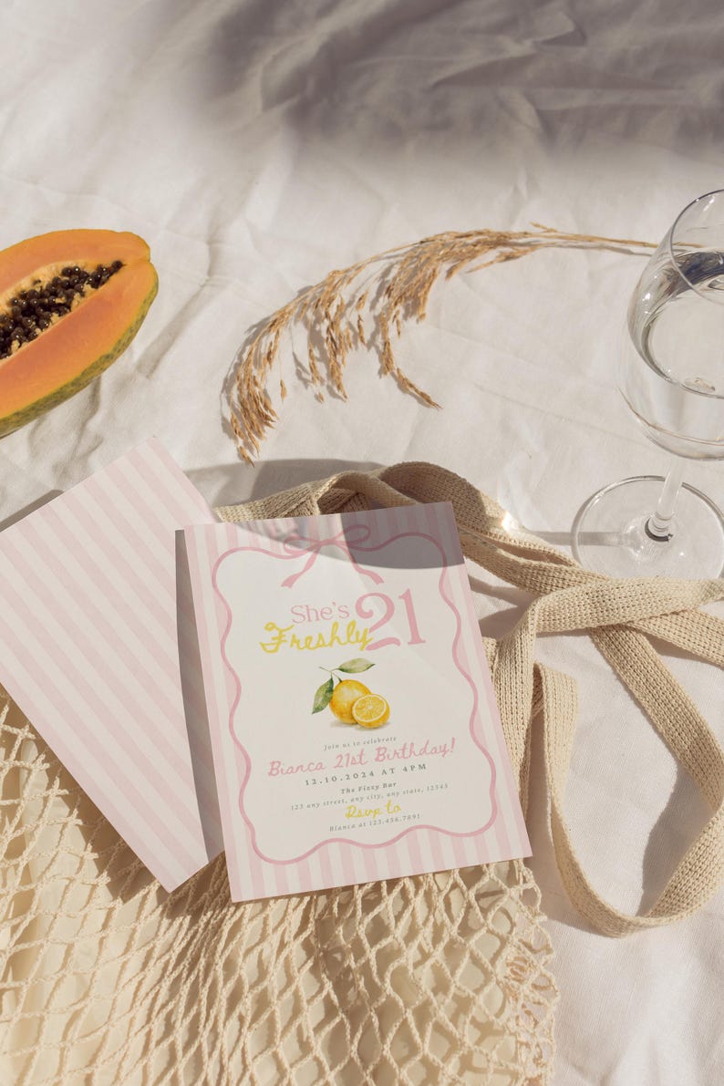 May include: A rectangular birthday invitation card with a light pink and white striped border, featuring the text She's Freshly 21, Bianca 21st Birthday, 12.10.2024 at 4PM, The Fizzy Bar, and RSVP details, decorated with a yellow lemon illustration.