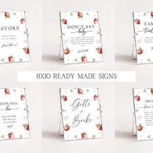 May include: Eight 8x10 inch printable signs with a strawberry theme for a baby shower. The signs include the text "Favors", "Don't Say Baby", "Family Traditions", "Mom-osa Bar", "Gifts + Books", and "Message from the Bump".